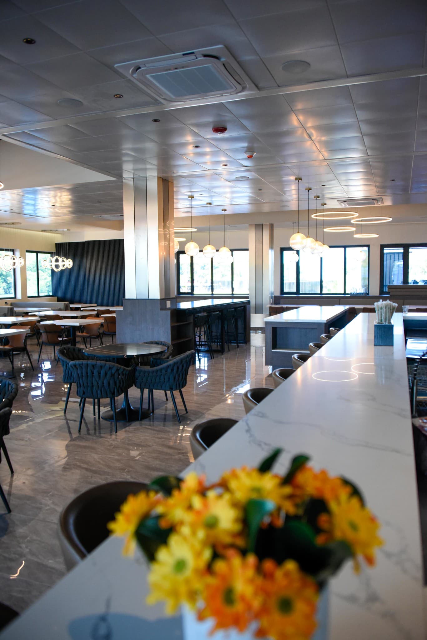 Bright restaurant seating and breakfast tables at Grand Resort & Residences Belize