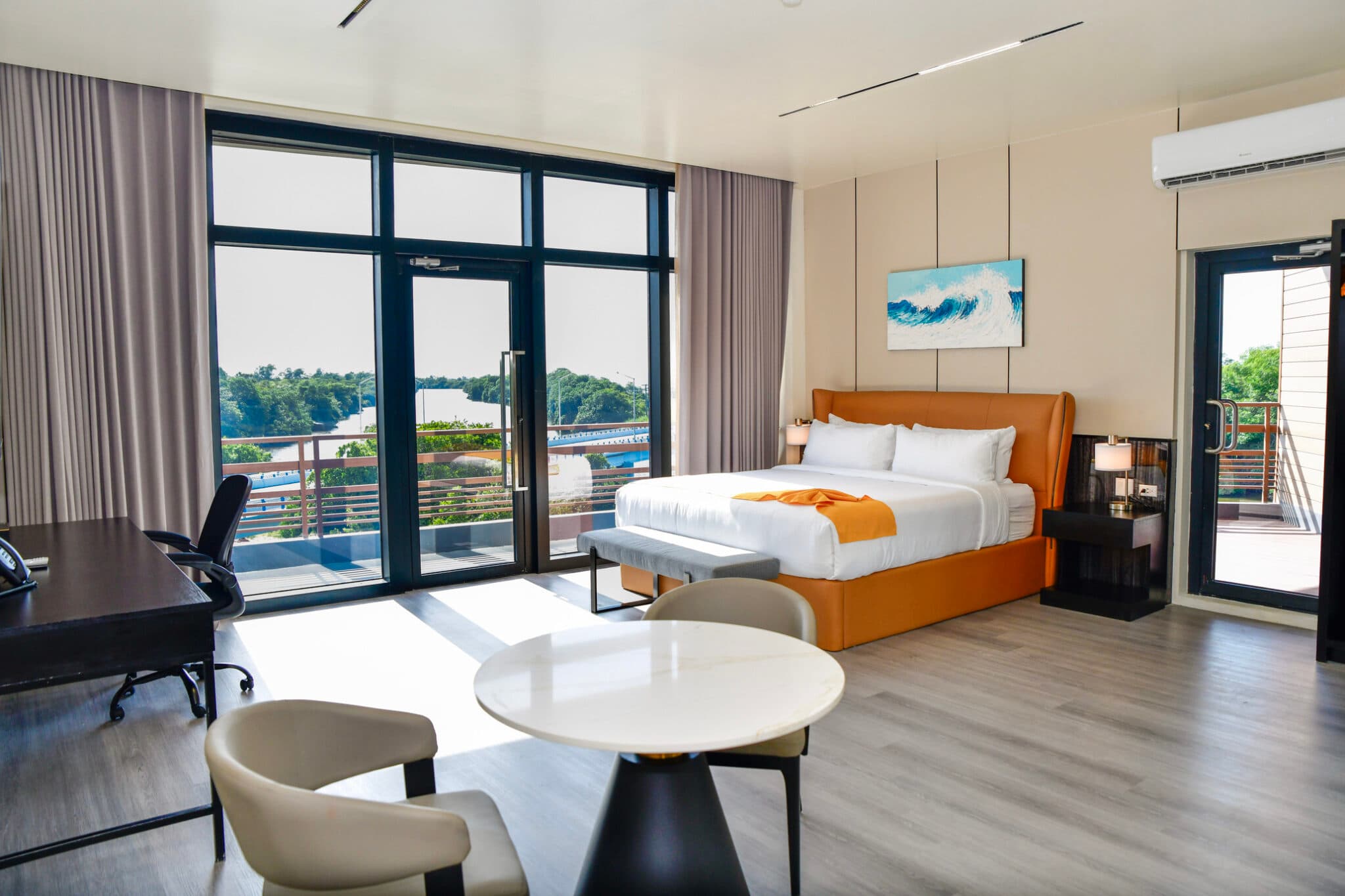 JR Master Suite with king bed and river views at Grand Resort & Residences